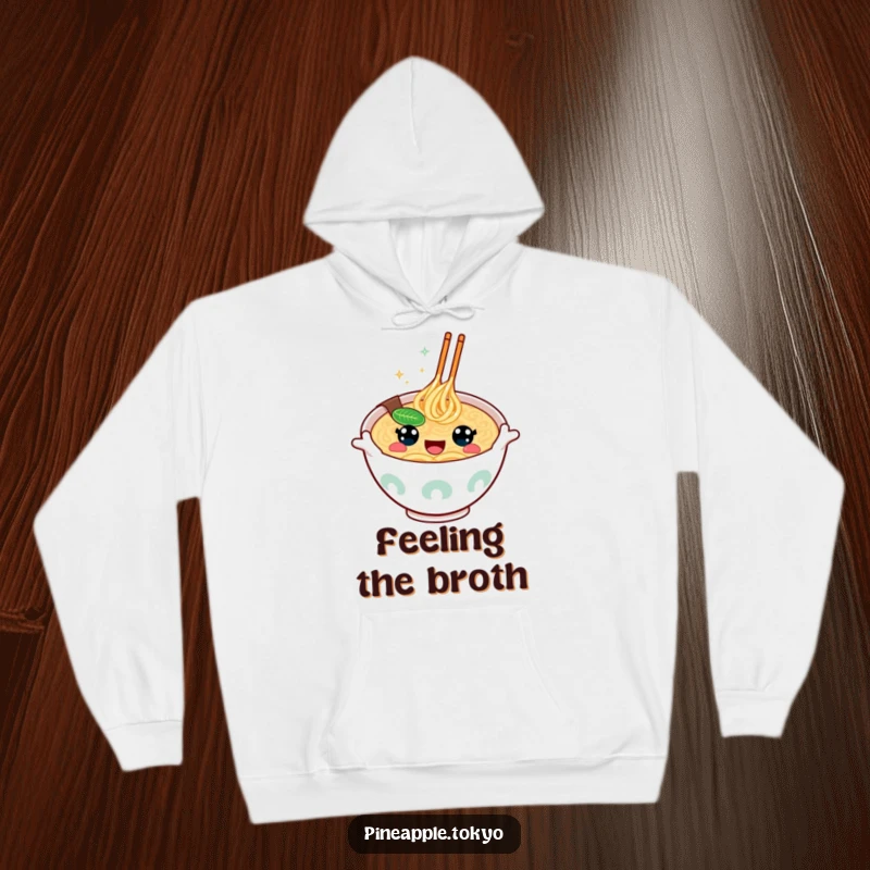 Funny happy-eyed ramen bowl, excitedly gesturing, featured on a warm and humorous hoodie. Cozy food lover apparel.