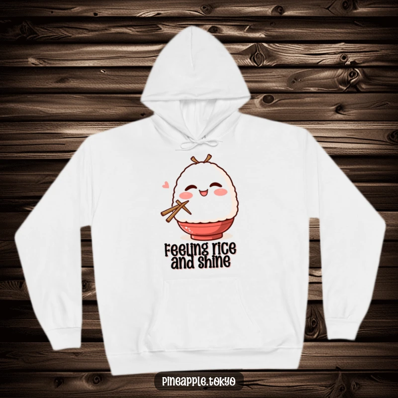 Funny blushing onigiri, winking and holding chopsticks, featured on a warm and humorous hoodie. Cozy Japanese food apparel.