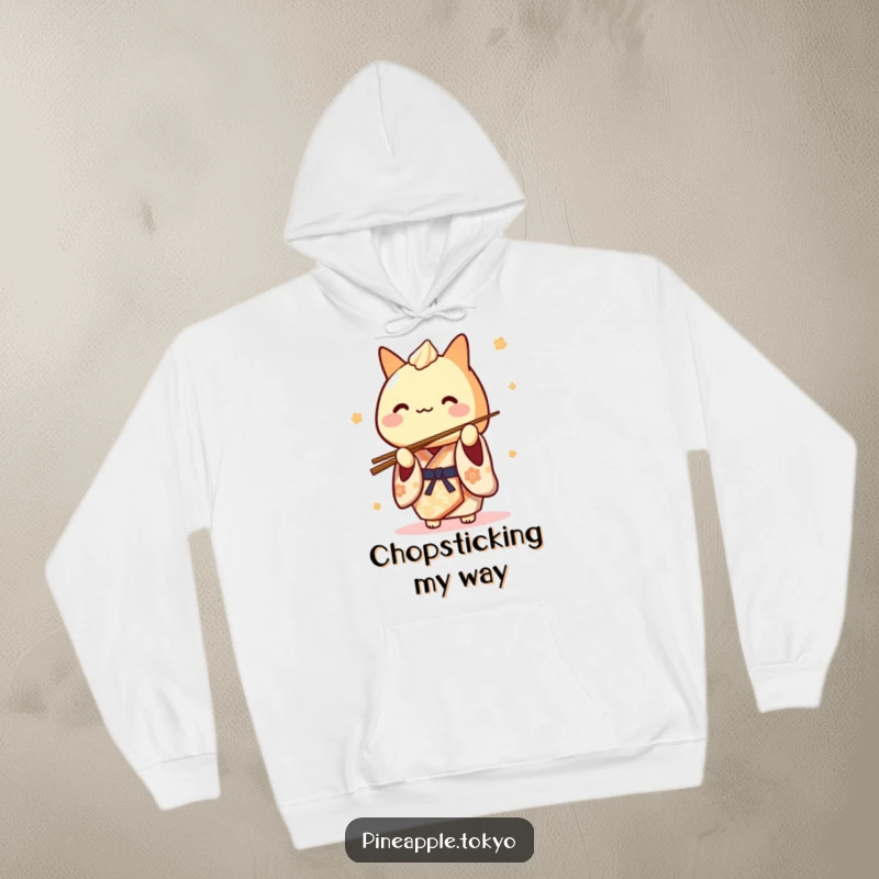 Funny Tamagoyaki Kimono Hoodie: a cute Japanese rolled omelet character in a kimono playfully balancing chopsticks, looking cozy.