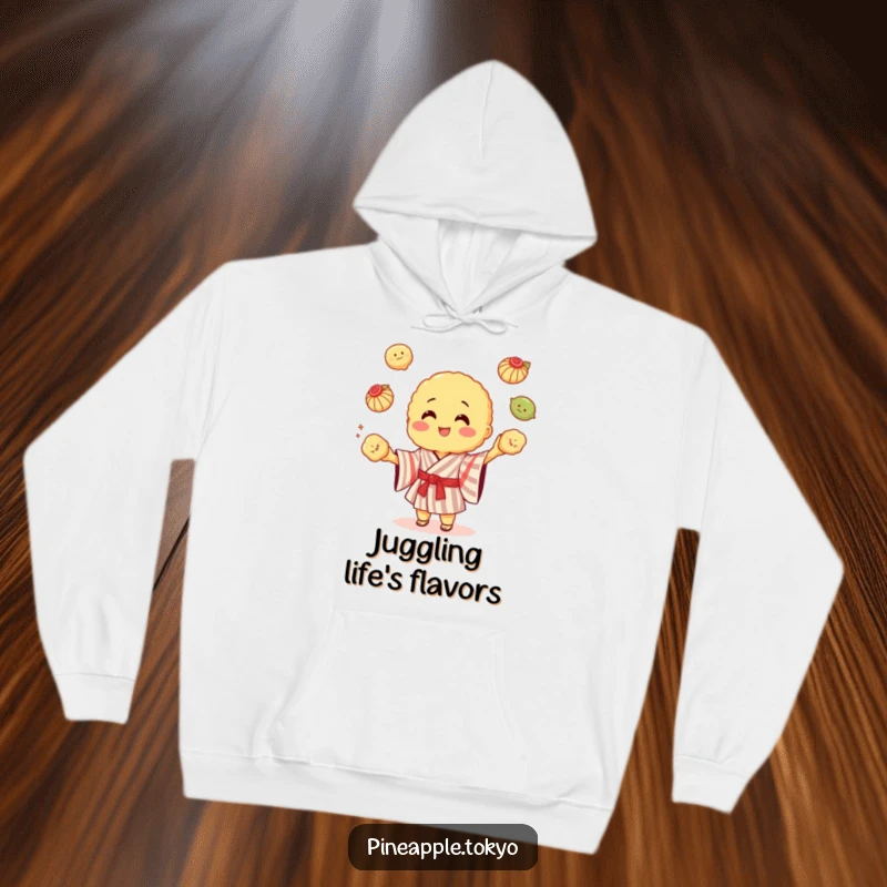 Funny cheerful tempura wearing a striped kimono, juggling dumplings, on a soft hoodie.