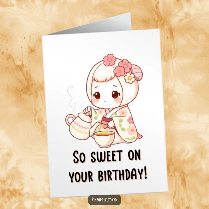 Funny Free Printable Birthday Card: Sweet mochi in floral kimono pouring tea from a tiny pot, offering gentle birthday wishes.