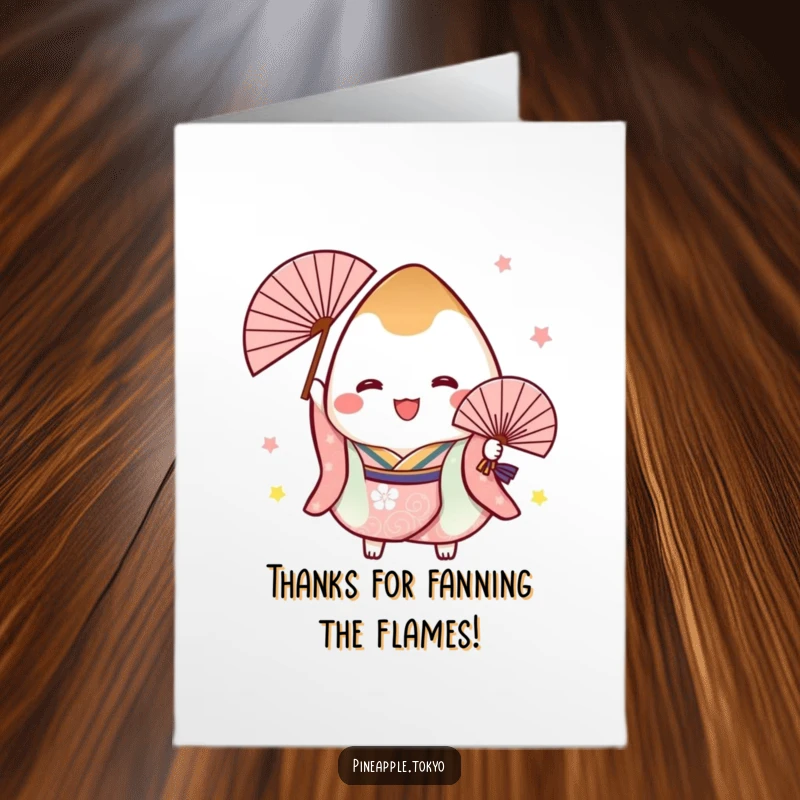 Funny free printable thank you card: A cheerful onigiri in a festive kimono joyfully holds a fan, expressing thanks.