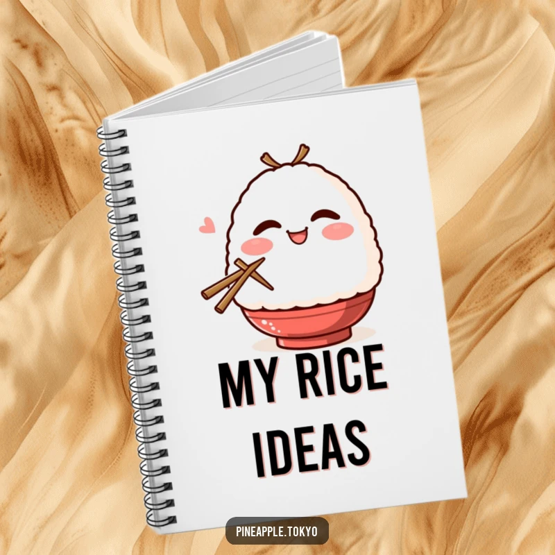 Funny smiling onigiri with blush, winking, and holding chopsticks on a humorous notebook cover.