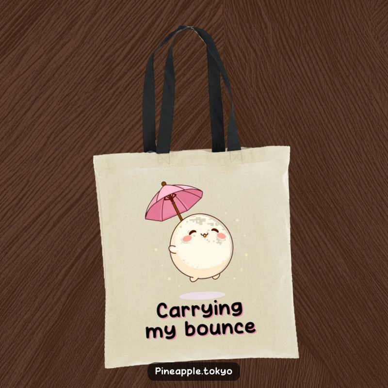 Funny adorable mochi ball bouncing playfully with a tiny umbrella on a durable and humorous tote bag.